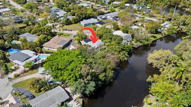 bird's eye view with a residential view and a water view