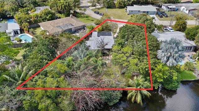 birds eye view of property with a residential view and a water view