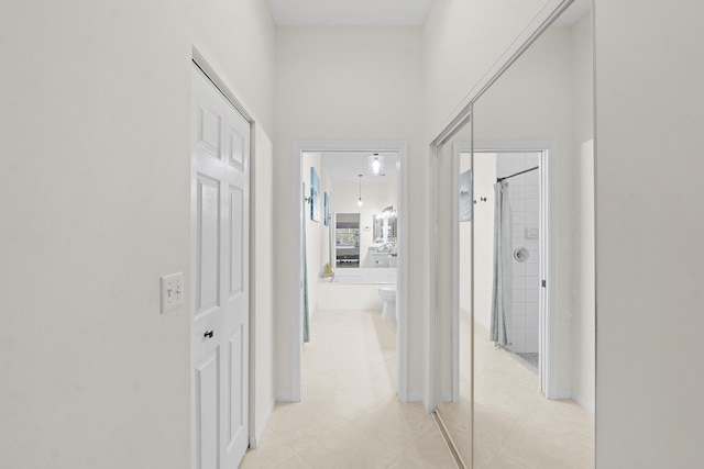 corridor with light tile patterned floors