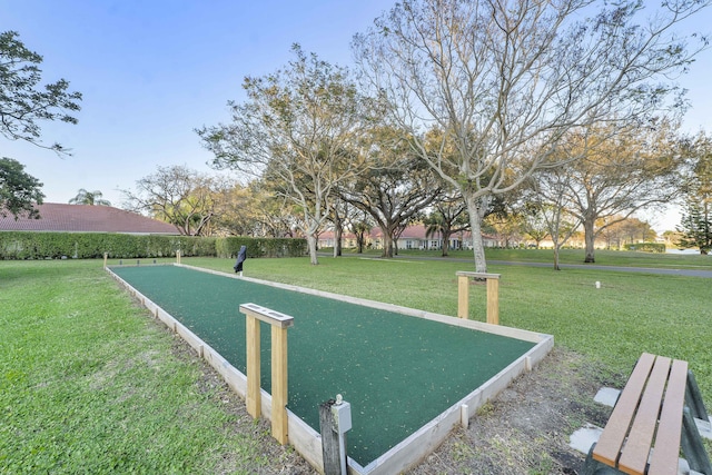 view of home's community with a lawn