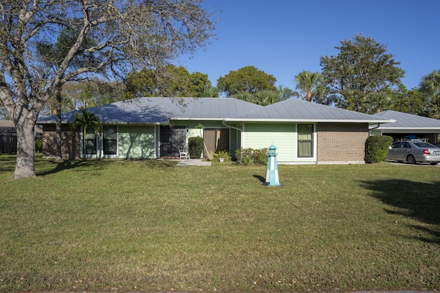 back of house with a lawn