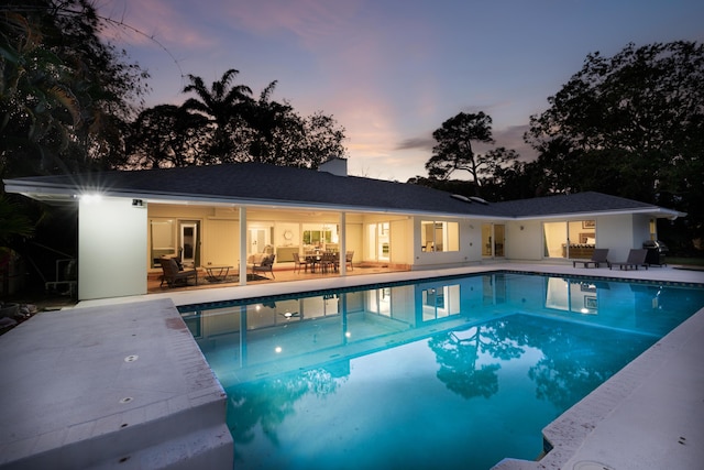 outdoor pool featuring a patio