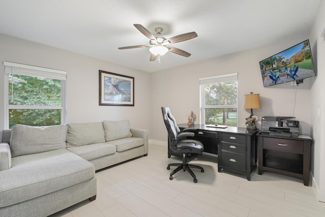 office with baseboards and a ceiling fan