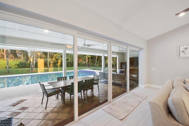 sunroom featuring vaulted ceiling