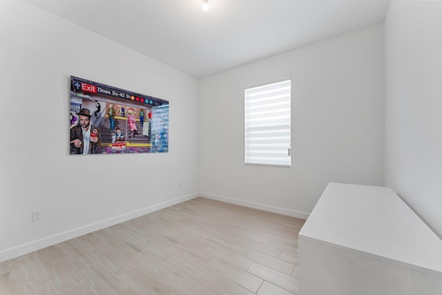 empty room with light hardwood / wood-style floors