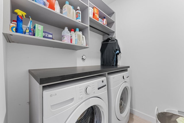 washroom featuring washer and dryer