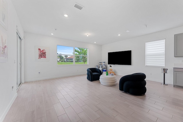 sitting room featuring light hardwood / wood-style floors