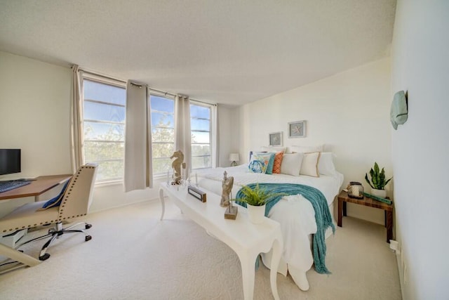 bedroom featuring light carpet