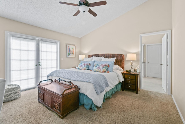 bedroom with lofted ceiling, a textured ceiling, ceiling fan, light carpet, and access to exterior