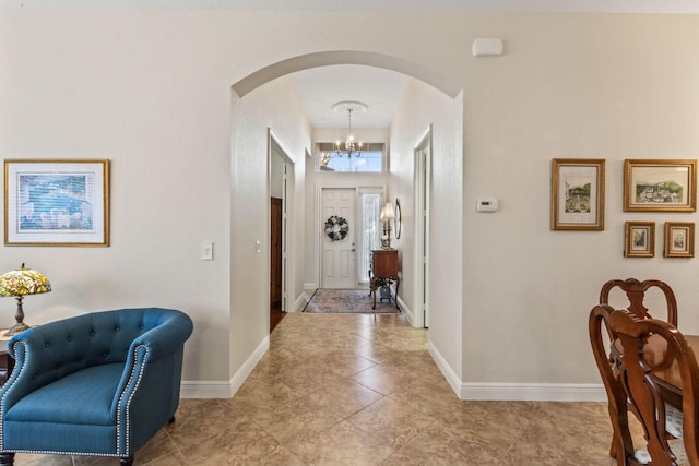 entrance foyer featuring a notable chandelier