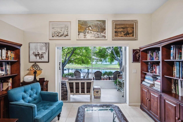 living area featuring light tile patterned flooring and plenty of natural light