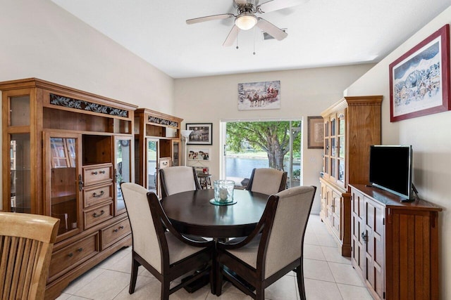 dining area with light tile patterned floors and ceiling fan