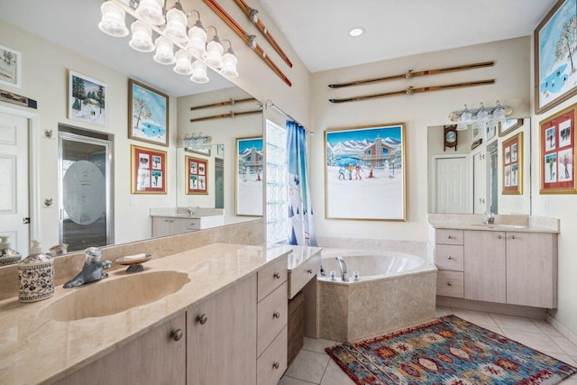 bathroom with a stall shower, a bath, tile patterned floors, and a sink