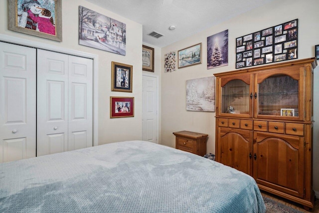 bedroom featuring a closet and visible vents