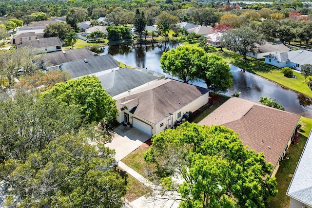 bird's eye view featuring a water view and a residential view