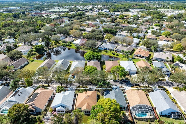 bird's eye view featuring a water view and a residential view