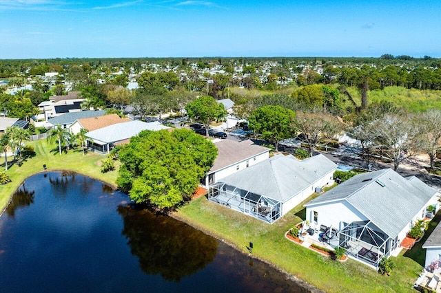 birds eye view of property featuring a water view and a residential view