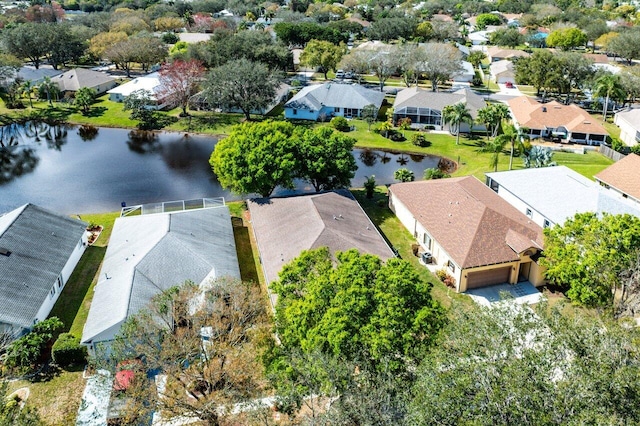 bird's eye view featuring a water view and a residential view
