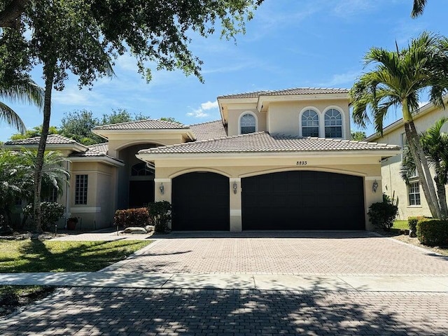 mediterranean / spanish-style house featuring a garage