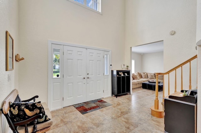 entryway with a high ceiling