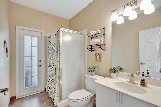 bathroom featuring vanity, tile patterned flooring, curtained shower, and toilet