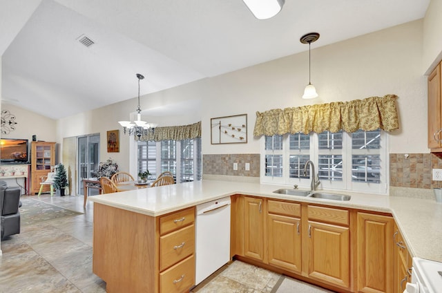 kitchen featuring sink, hanging light fixtures, kitchen peninsula, and dishwasher