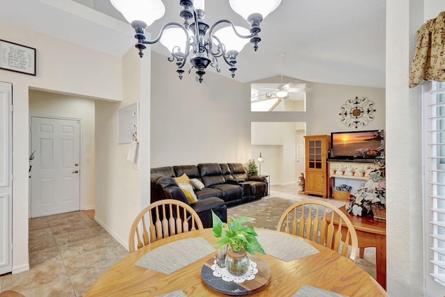 dining area with ceiling fan with notable chandelier, high vaulted ceiling, and light tile patterned floors