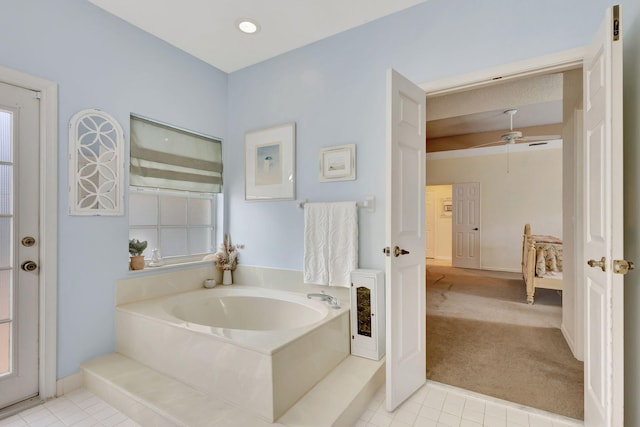 bathroom with tile patterned flooring and a bathtub