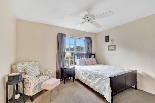 bedroom featuring ceiling fan and light colored carpet