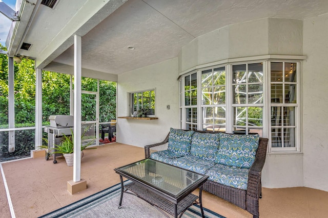 view of patio with an outdoor living space and a grill