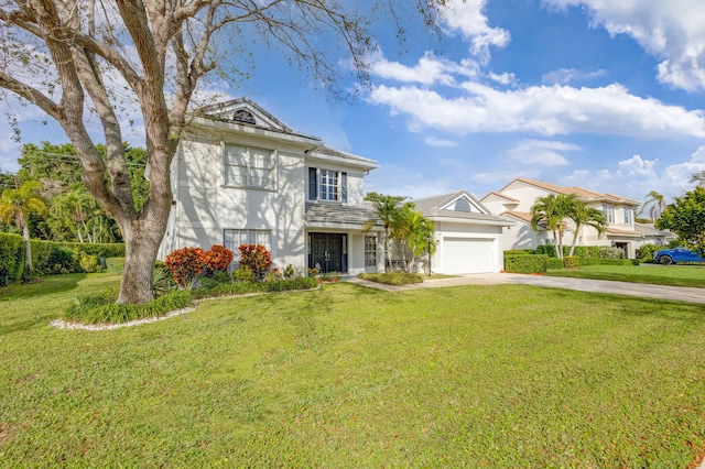 view of front facade with a garage and a front yard