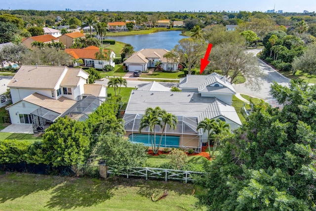 birds eye view of property with a water view