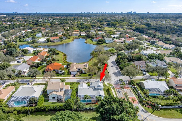 birds eye view of property featuring a water view