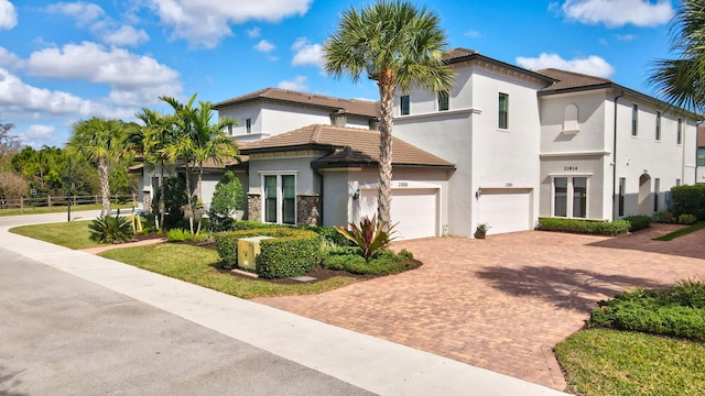 mediterranean / spanish-style home featuring a garage