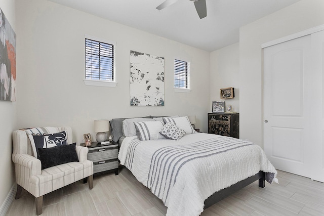 bedroom with multiple windows, a closet, and ceiling fan