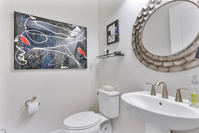 bathroom featuring toilet and sink