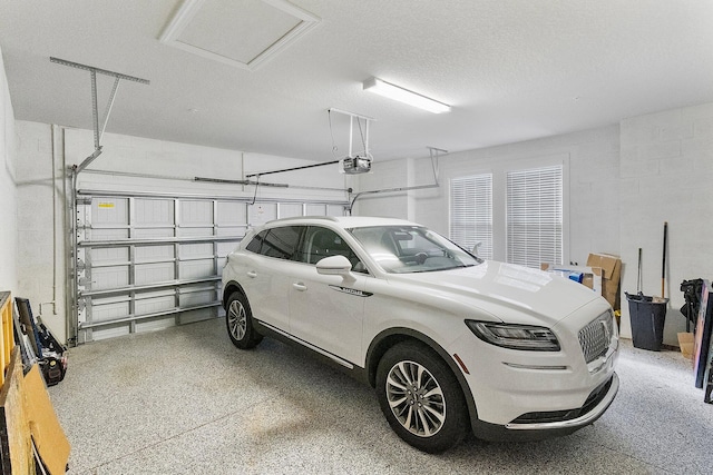 garage featuring a garage door opener