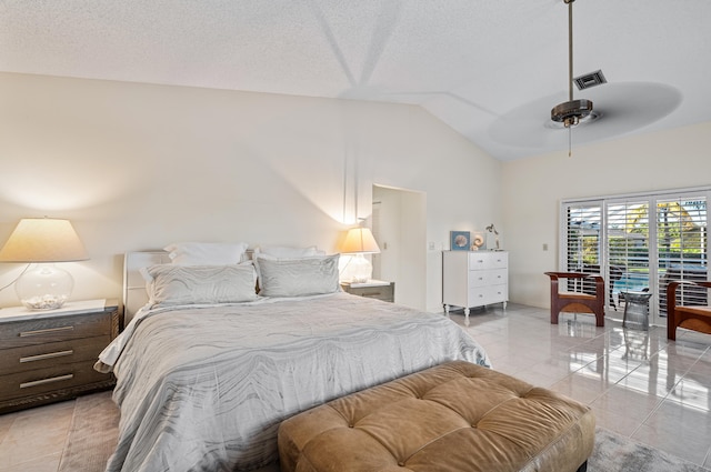 tiled bedroom featuring vaulted ceiling, access to outside, ceiling fan, and a textured ceiling