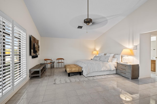 tiled bedroom featuring ceiling fan and lofted ceiling