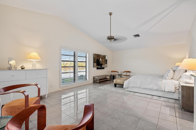 tiled bedroom featuring ceiling fan and vaulted ceiling