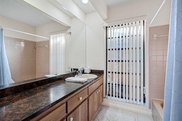 bathroom featuring vanity, tile patterned flooring, and shower / bath combo with shower curtain