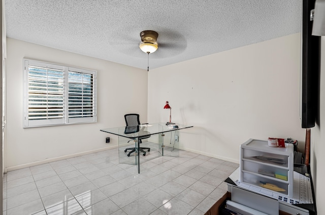 unfurnished office with ceiling fan, a textured ceiling, and light tile patterned floors