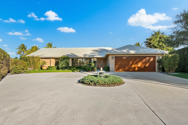 single story home with a garage
