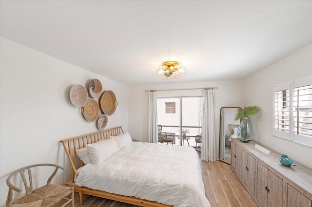 1300 Seaway Dr Unit B6, Fort Pierce, FL 34949 - bedroom featuring a textured ceiling and light wood-type flooring