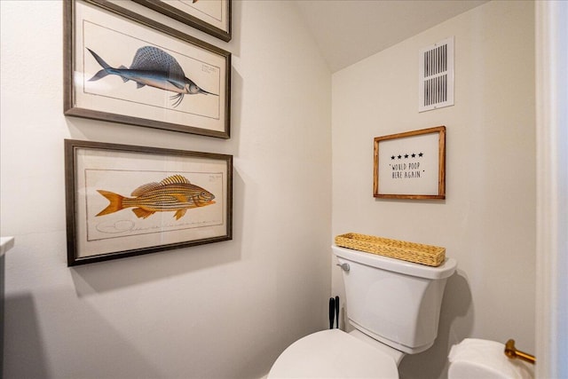 1300 Seaway Dr Unit B6, Fort Pierce, FL 34949 - bathroom featuring toilet and vaulted ceiling