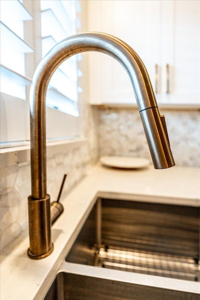 1300 Seaway Dr Unit B6, Fort Pierce, FL 34949 - interior details featuring white cabinetry and sink
