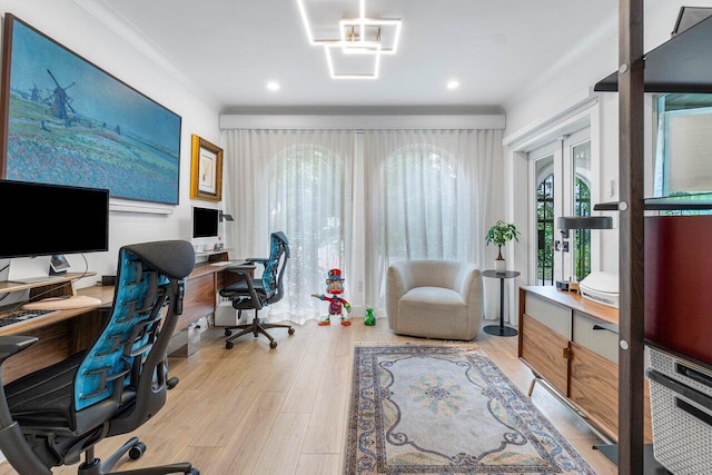 office space featuring crown molding, light hardwood / wood-style floors, and french doors