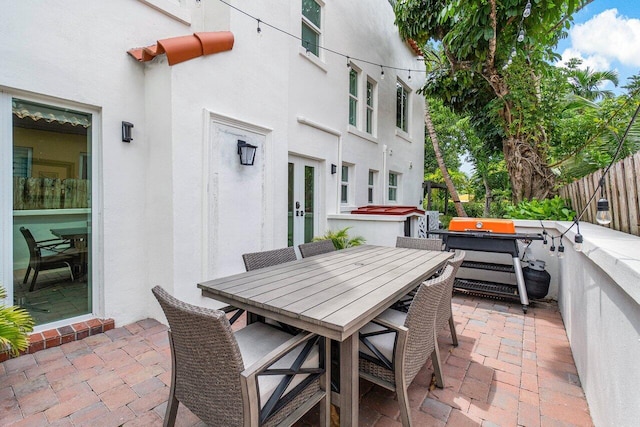 view of patio featuring a jacuzzi