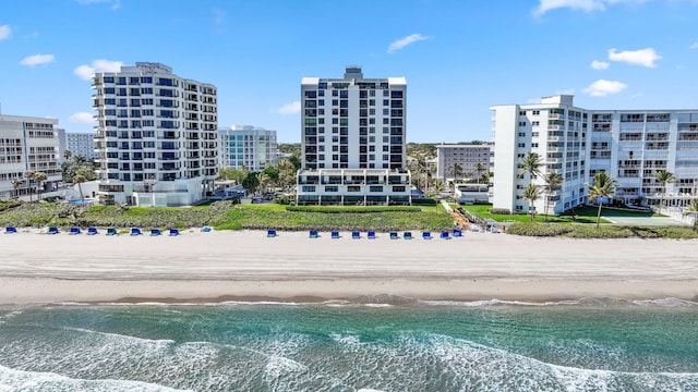 birds eye view of property featuring a view of the beach and a water view