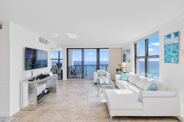 living room featuring ornamental molding and floor to ceiling windows